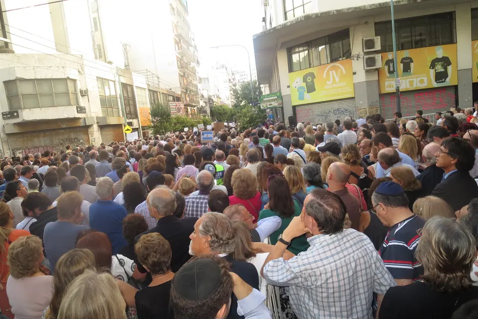 A large crowd fills a Buenos Aires street for the annual AMIA bombing commemoration