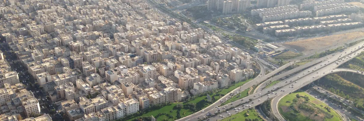 Aerial view of Tehran apartment blocks and a highway interchange